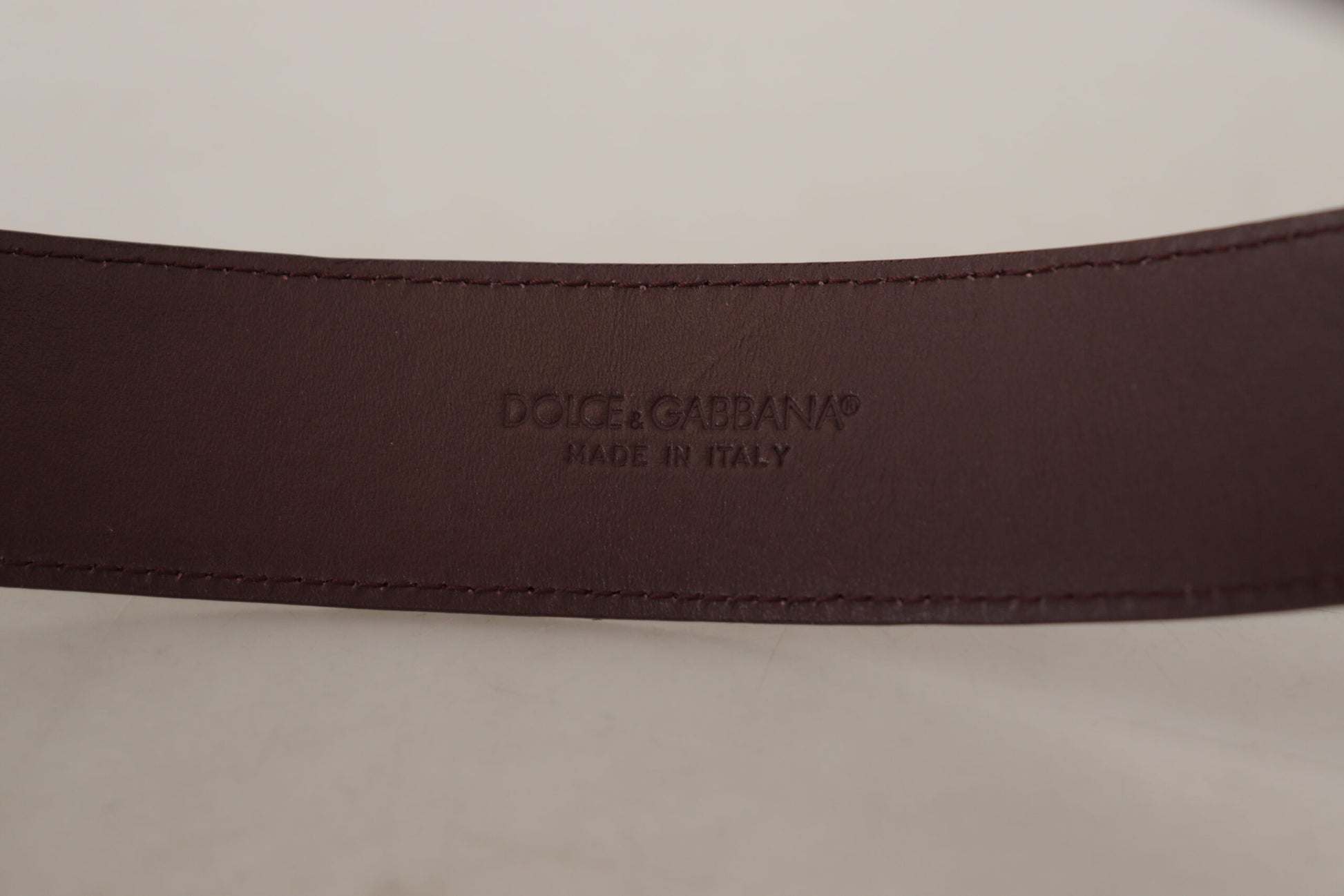 Dolce & Gabbana Elegant Maroon Leather Belt with Engraved Buckle